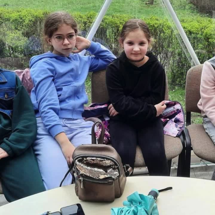 Two young people spending time together at camp