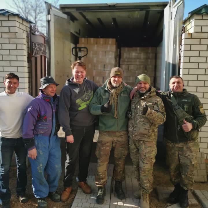 S4HK volunteers gathered beside an aid truck